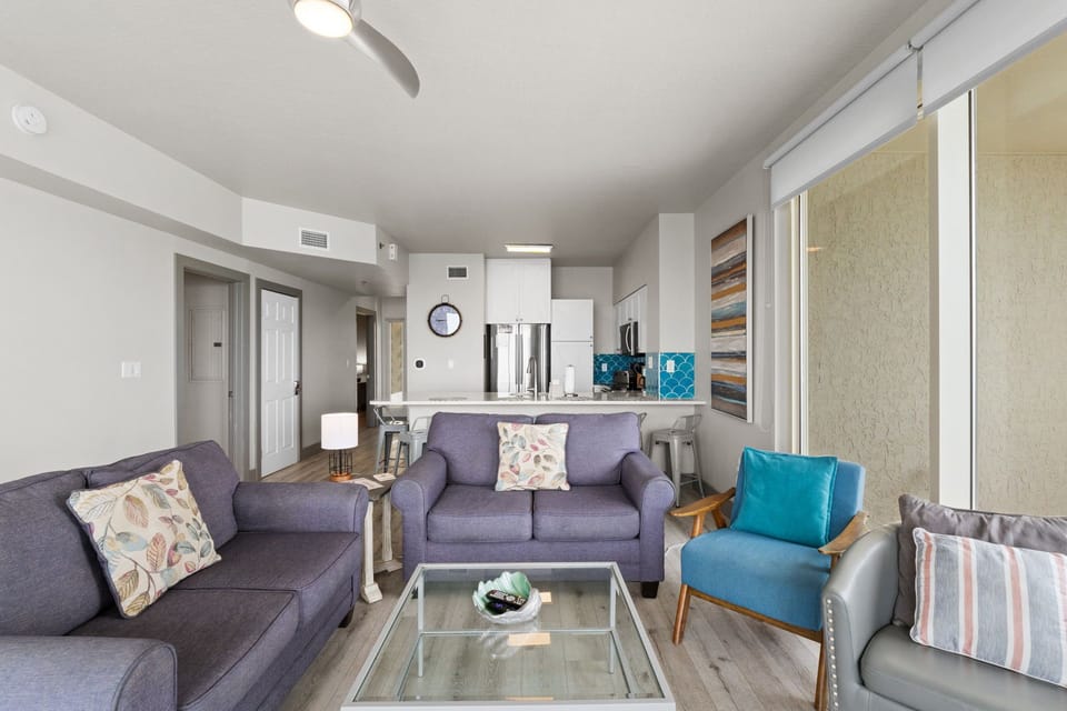 Altogether, the living room is a spacious and inviting area designed for comfort and connection.
