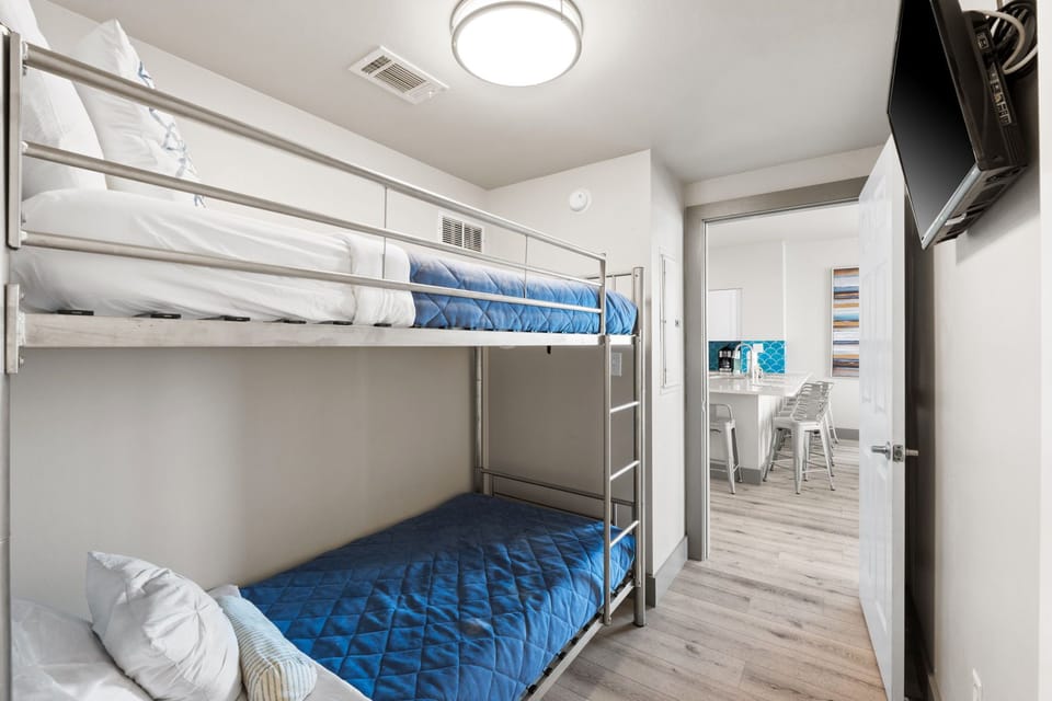 The bunk room features two twin beds and provides a cozy, comfortable space for younger guests or extra sleepers.