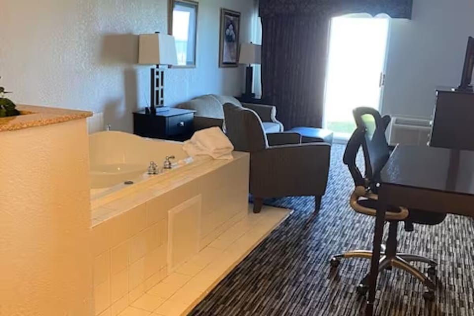 Sink into a soothing jetted soak steps from your bed.