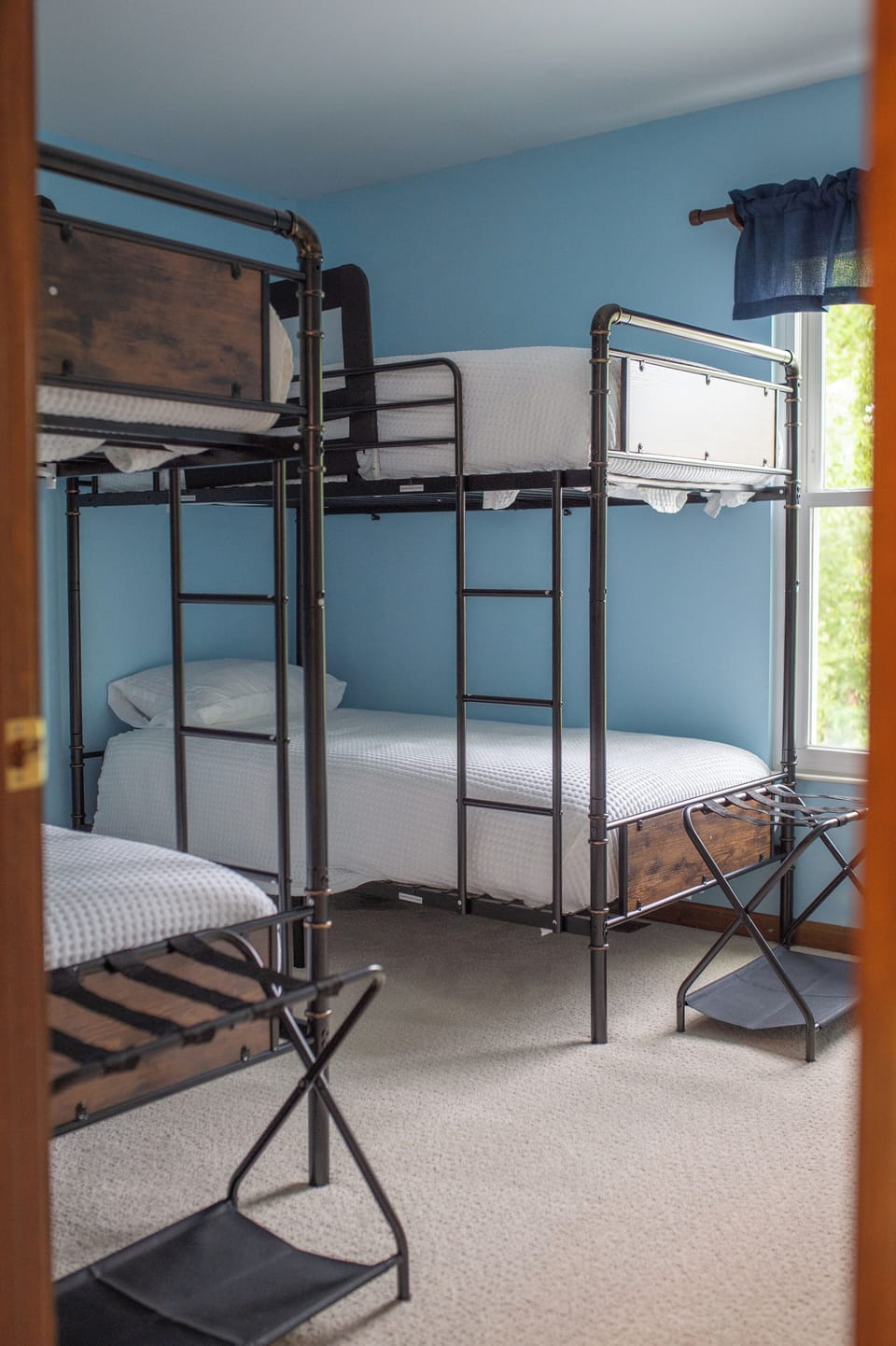 Bright bunk room with multiple beds—perfect for families and groups