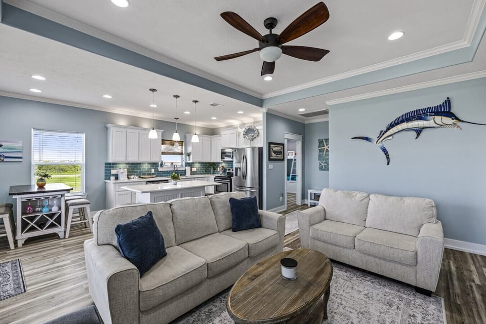 Gather together in a bright beach-inspired living area designed for comfort and relaxation