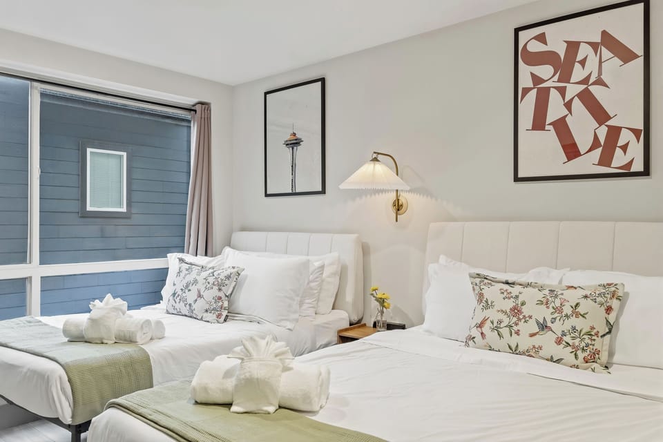 Cozy comfort meets nature with a bed that looks out to rolling hills.