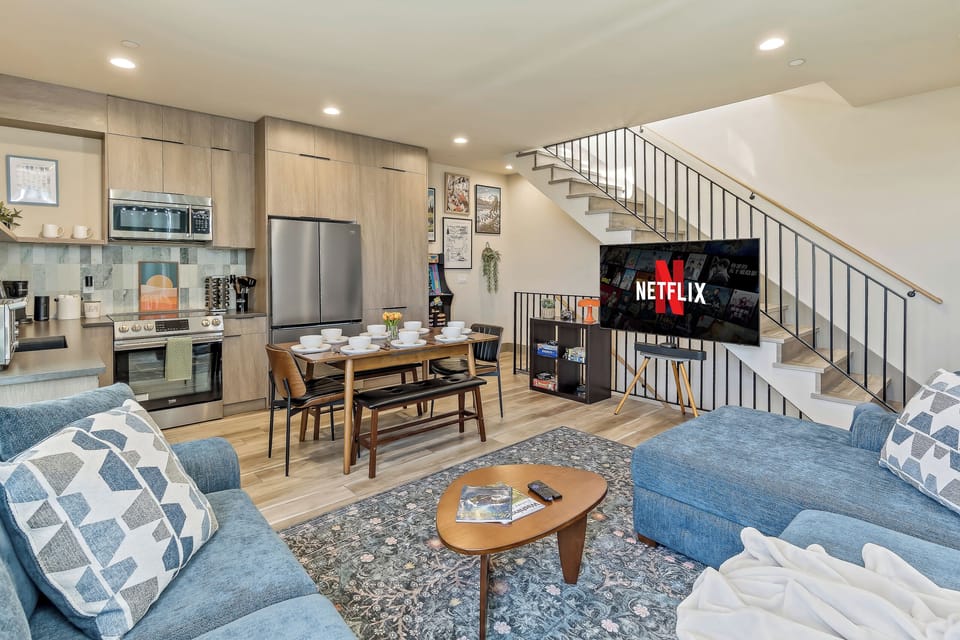 Contemporary charm flows seamlessly from kitchen to living room.