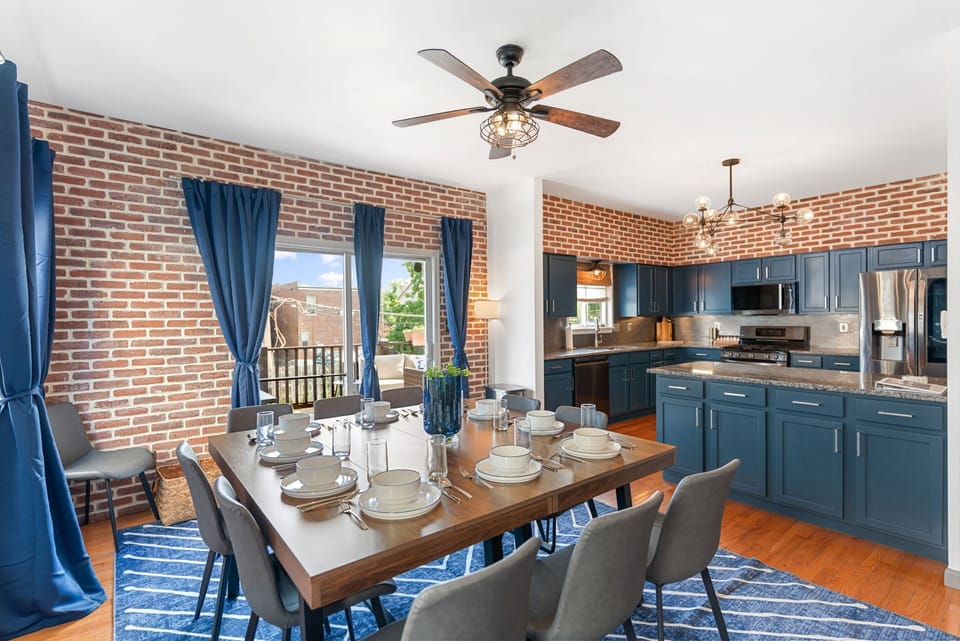 Gather everyone comfortably in the open-concept kitchen and dining space with seating designed for large groups