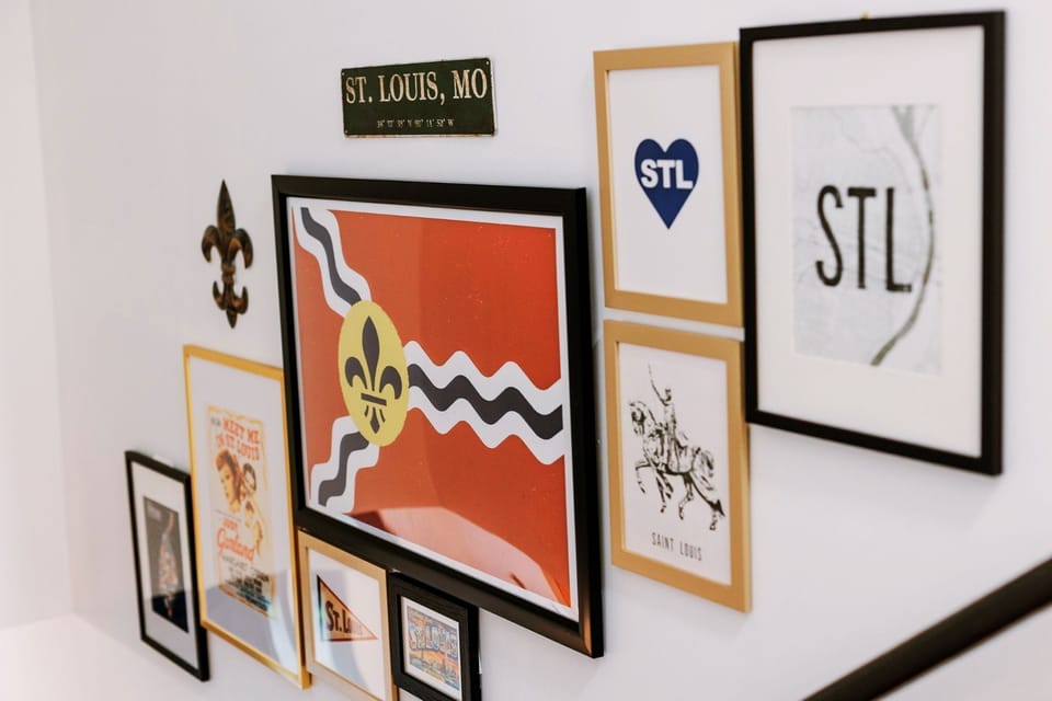 Local artwork and design details celebrate the spirit of St. Louis throughout the home, especially while heading upstairs to the bedroom level.