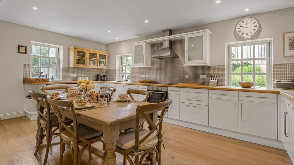 A spacious kitchen with oven and hob, fridge-freezer, toaster, microwave, kettle, washing machine, dryer and Nespresso coffee machine