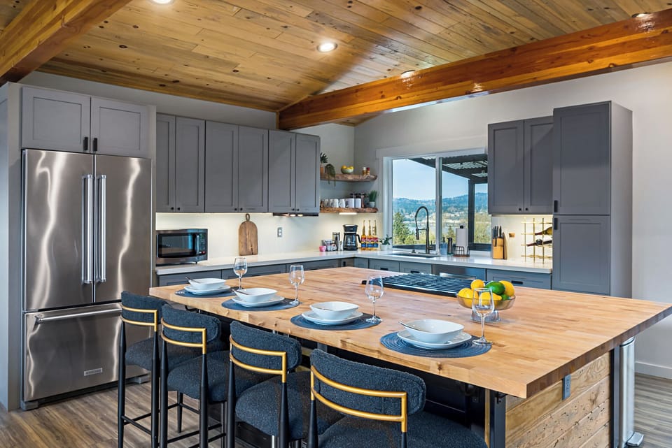 Fully equipped kitchen with stunning views and ample seating.
