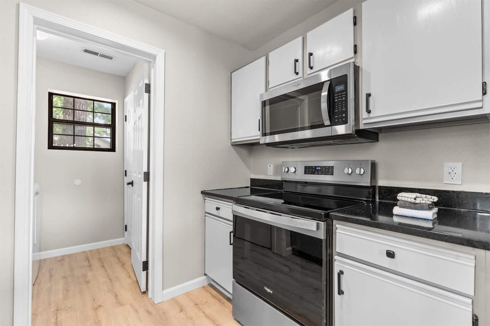 The open kitchen offers ample space & all the comforts of home​