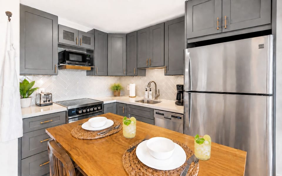 Modern Sapphire Beach Condo Kitchen with Stainless Steel Appliances & Dishwasher