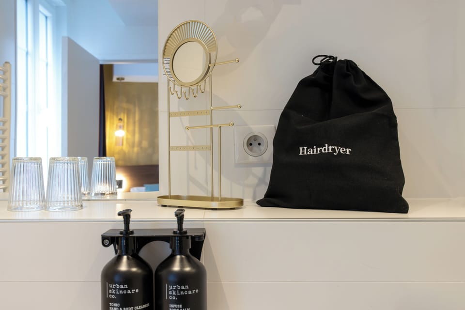 Hair dryer, towels, soap, shampoo