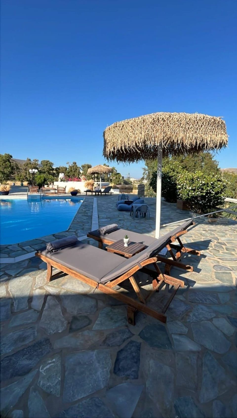 Sunbeds and Poolside Umbrella Lounge