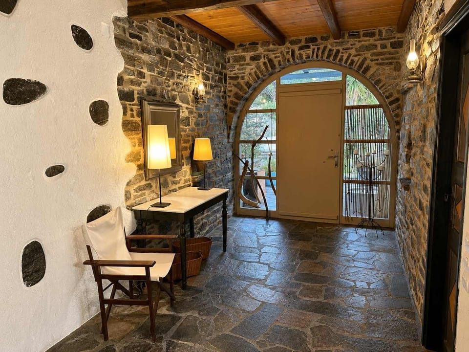 Rustic Stone Entrance Hall with Warm Lighting