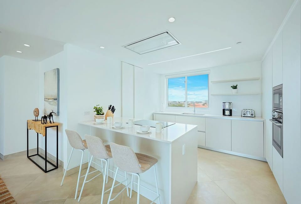Bright, modern kitchen awaits your culinary adventures with sleek counters, stainless appliances, and a sunny island perfect for morning coffee and meal prep together.