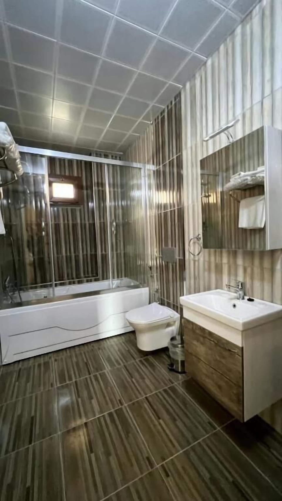 Shower, hair dryer, slippers, towels