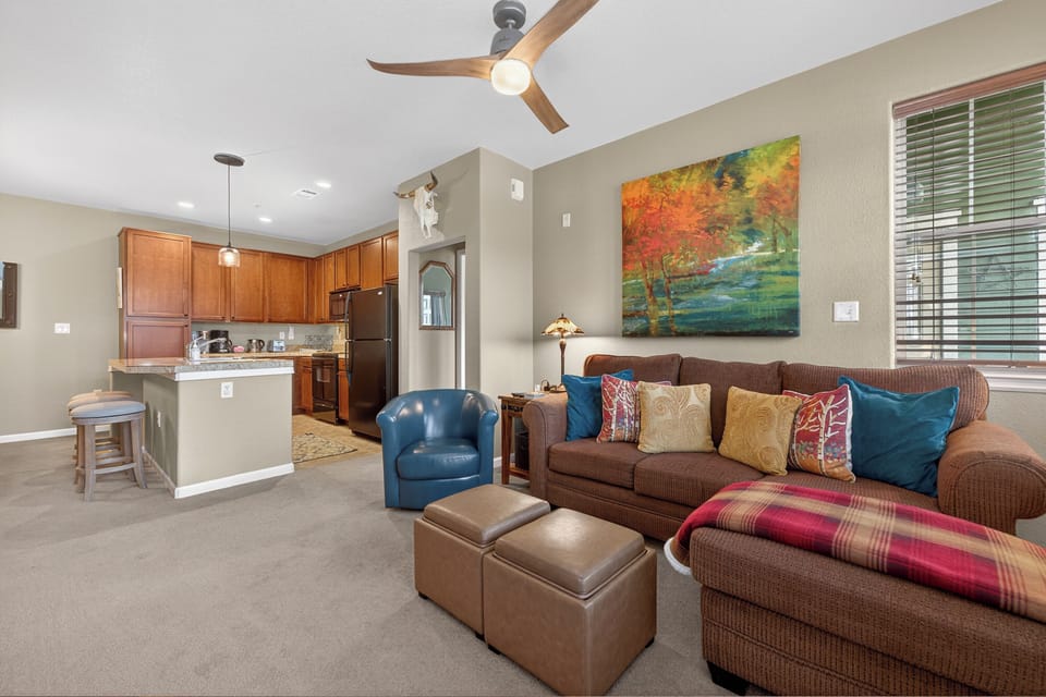 Settle into your inviting living area featuring comfortable seating and an open kitchen—perfect for relaxing evenings and making yourself at home.
