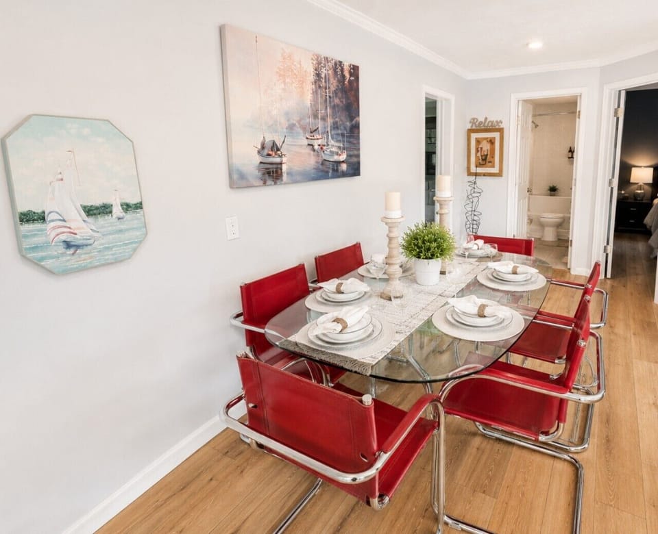 Stylish dining area with seating for six, modern furnishings, and coastal-inspired décor—perfect for family meals, entertaining, and memorable lake house gatherings.