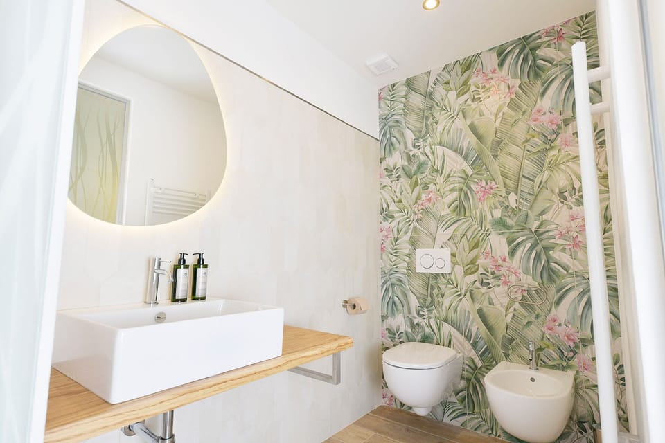 Luxury Double Room, Garden View | Bathroom | Hair dryer, slippers, towels, soap