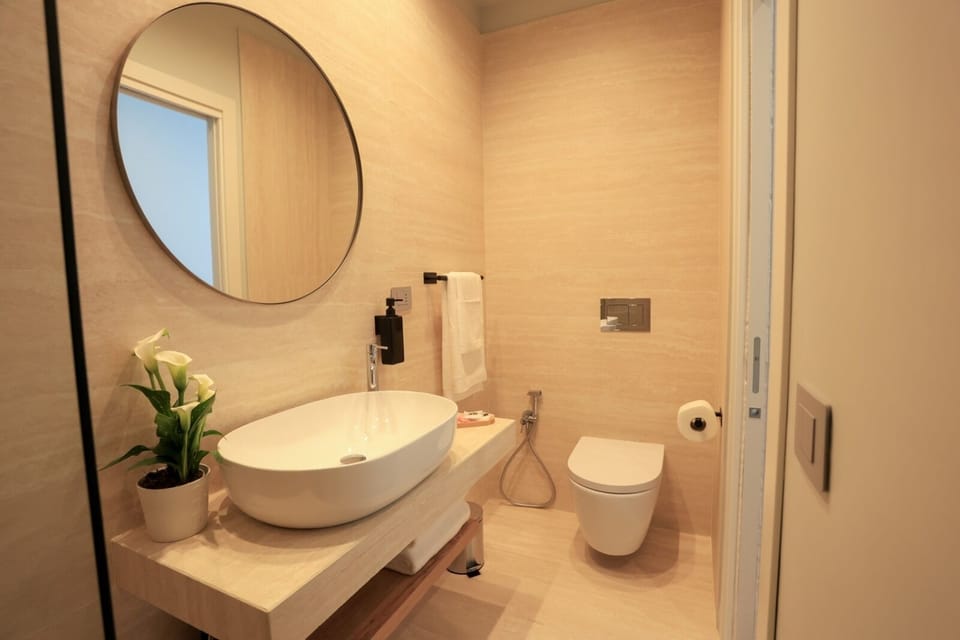 Studio Suite, City View | Bathroom | Shower, hair dryer, slippers, towels