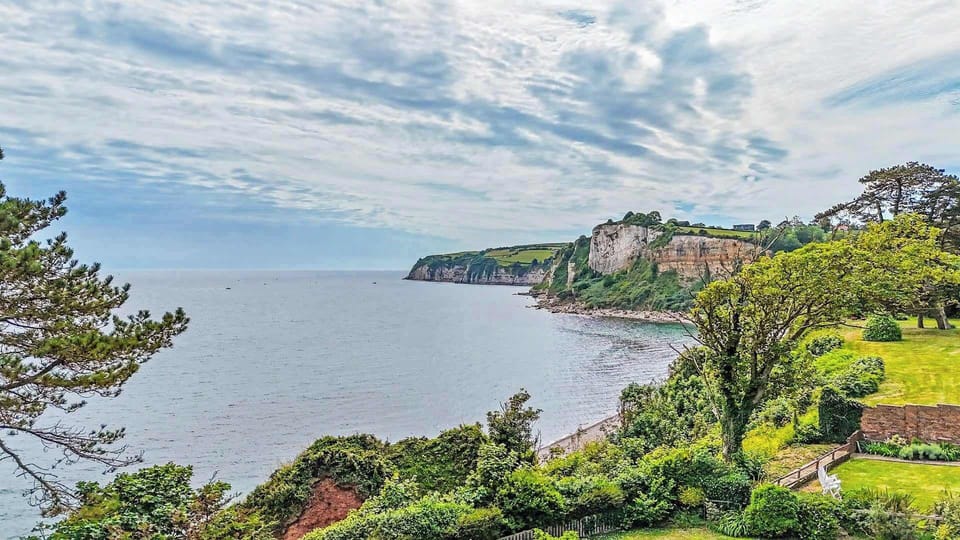 Beautiful sea views from the garden, creating a peaceful backdrop for morning coffee, family time and relaxed evenings outdoors.
