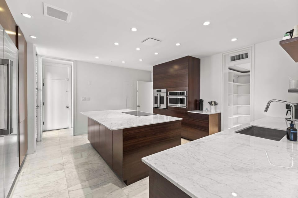 Designed for both everyday living and effortless entertaining, this stunning kitchen features contemporary finishes, premium appliances, and an expansive layout.