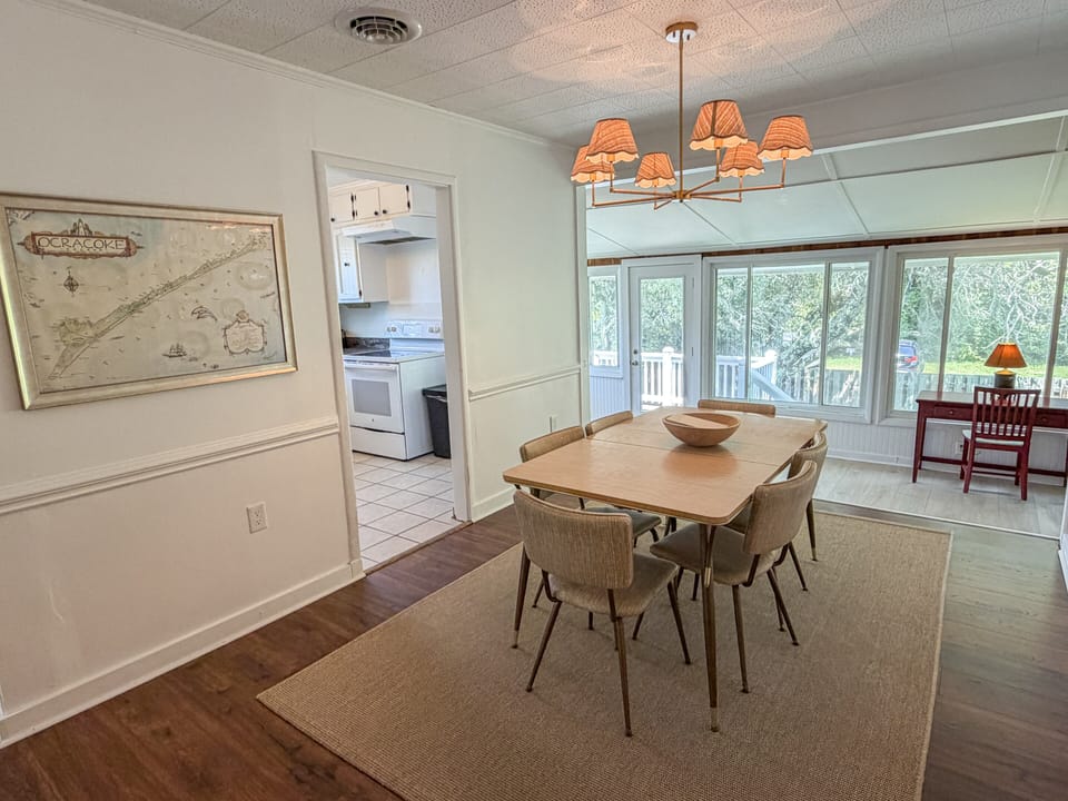 Dining Area With Sunroom and Kitchen Access