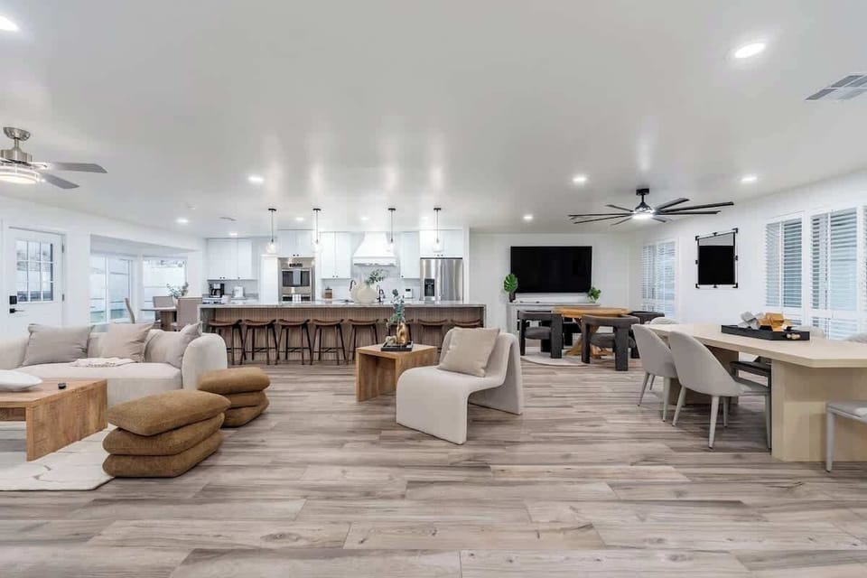 Sink into plush seating in your open-concept haven, where natural light floods the space, warm wood tones invite conversation, and a chef's kitchen awaits your culinary adventures.