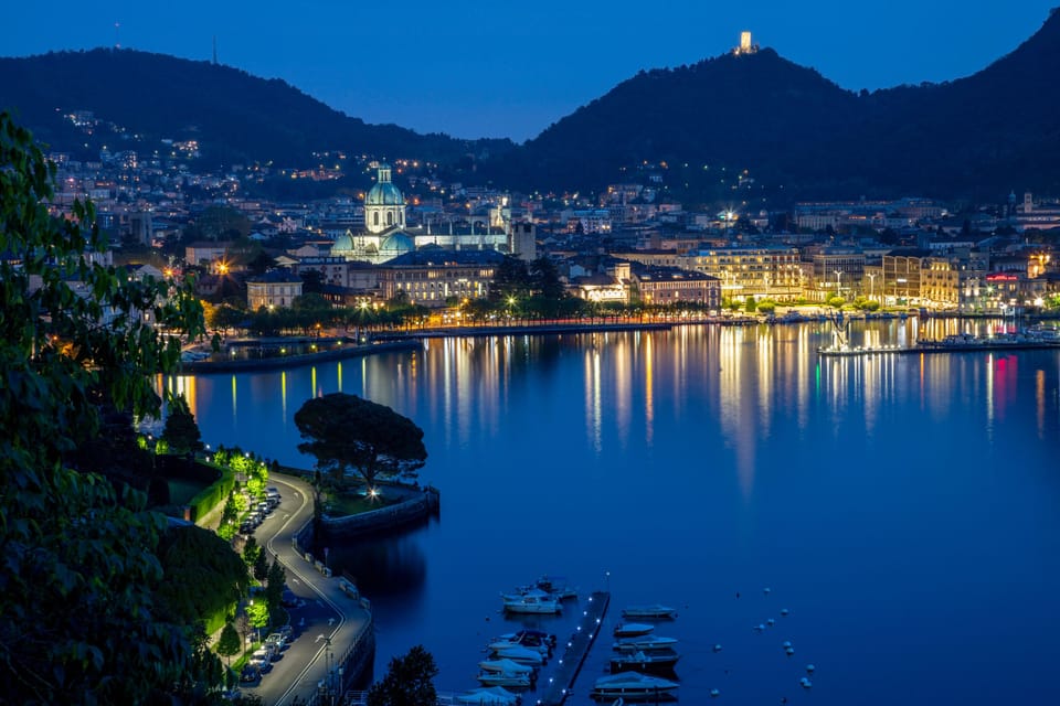 Night view of the city center with the lake promenade full of lights