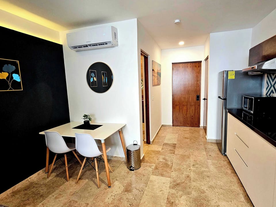 Well-lit studio with kitchen and dining — ideal for longer stays