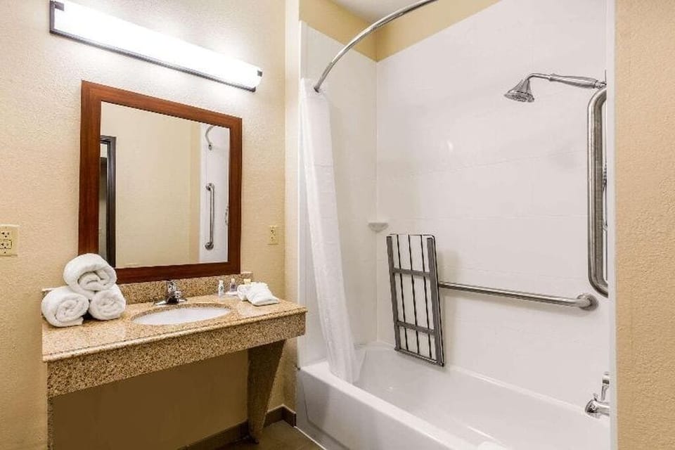 Bathtub, hair dryer, towels, soap