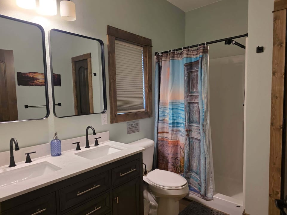 Ensuite full bathroom connected to the upper-level king suite, featuring modern fixtures and convenient access.