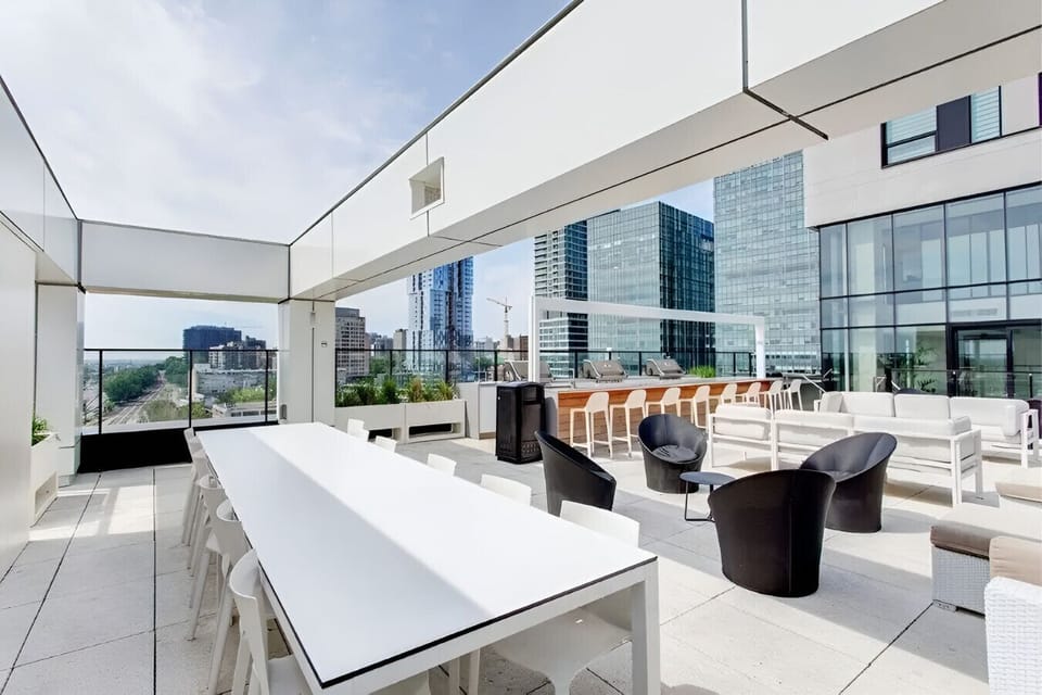 Gather, grill, and unwind in this stylish shared rooftop space, featuring BBQ stations, lounge seating, and breathtaking city views