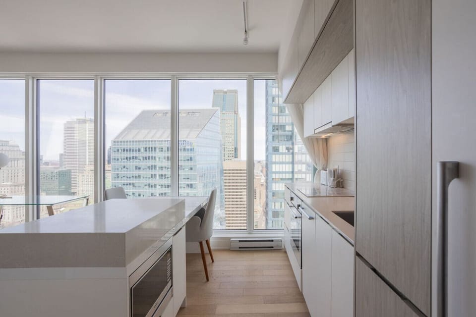 Enjoy another view of the modern kitchen, featuring integrated appliances and an airy open layout