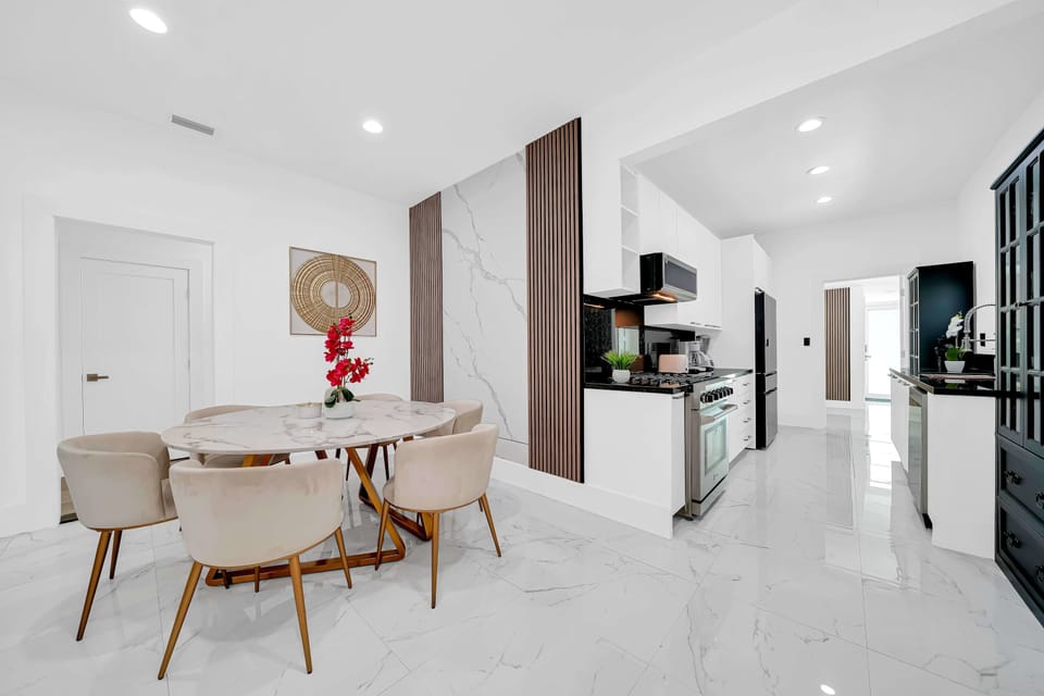 Cook, dine, and connect in this spacious open-concept kitchen and dining area.