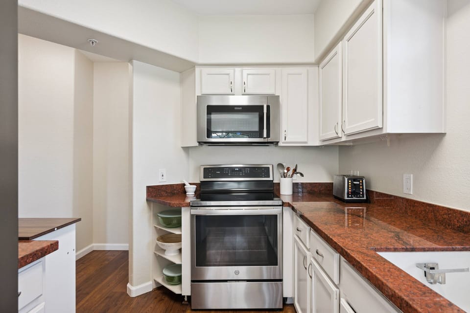 Kitchen with microwave, stove/oven, fridge, dishwasher, Traditional Coffee Maker, utensils etc