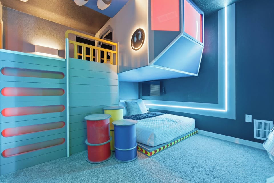 Rest in a playful futuristic themed bedroom with a cozy low bed, colorful wall panels, LED lighting, loft-style design, soft carpet, and fun decor, creating a unique space for kids during vacation.