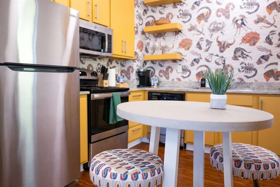 This full kitchen has everything you need to whip up delicious meals, with a charming table for two—perfect for intimate dinners or a morning coffee date.