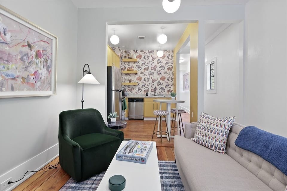 This open-concept living room flows effortlessly into the kitchen, making it perfect for entertaining and staying connected while you cook.