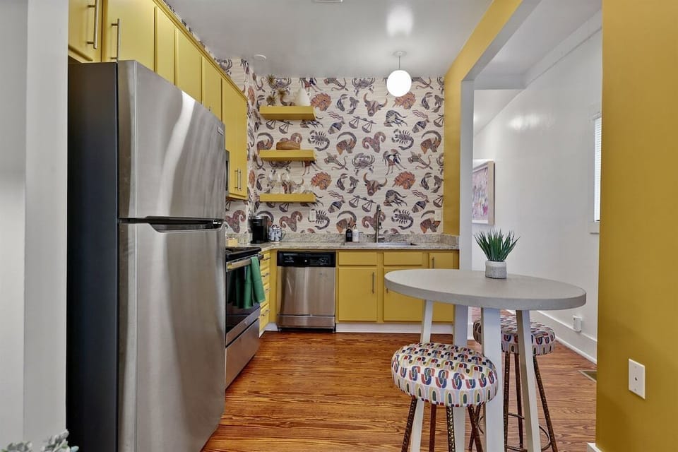 This full kitchen has everything you need to whip up delicious meals, with a charming table for two—perfect for intimate dinners or a morning coffee date.