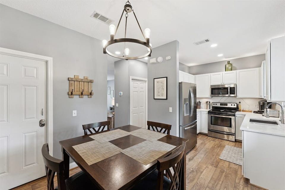 Cook, dine, and connect in this open-concept kitchen and dining area.