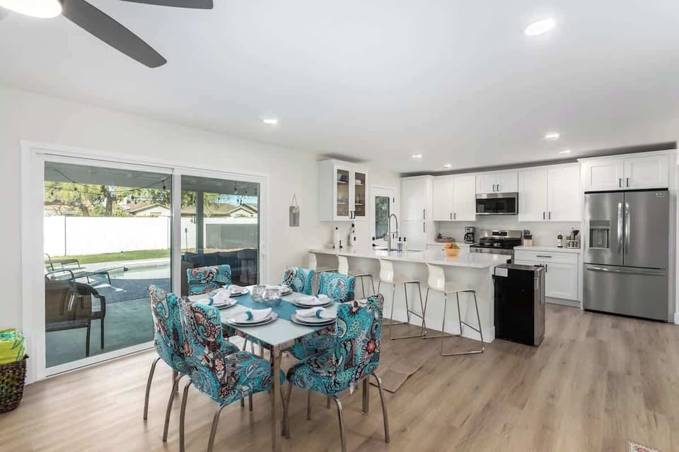 Dining Area | Open Concept | Colorful Chairs
