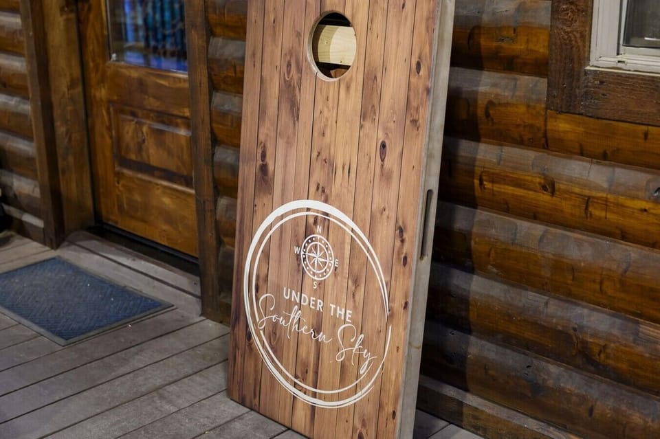 Branded cornhole boards hint at the spirited outdoor fun waiting under the Southern sky.