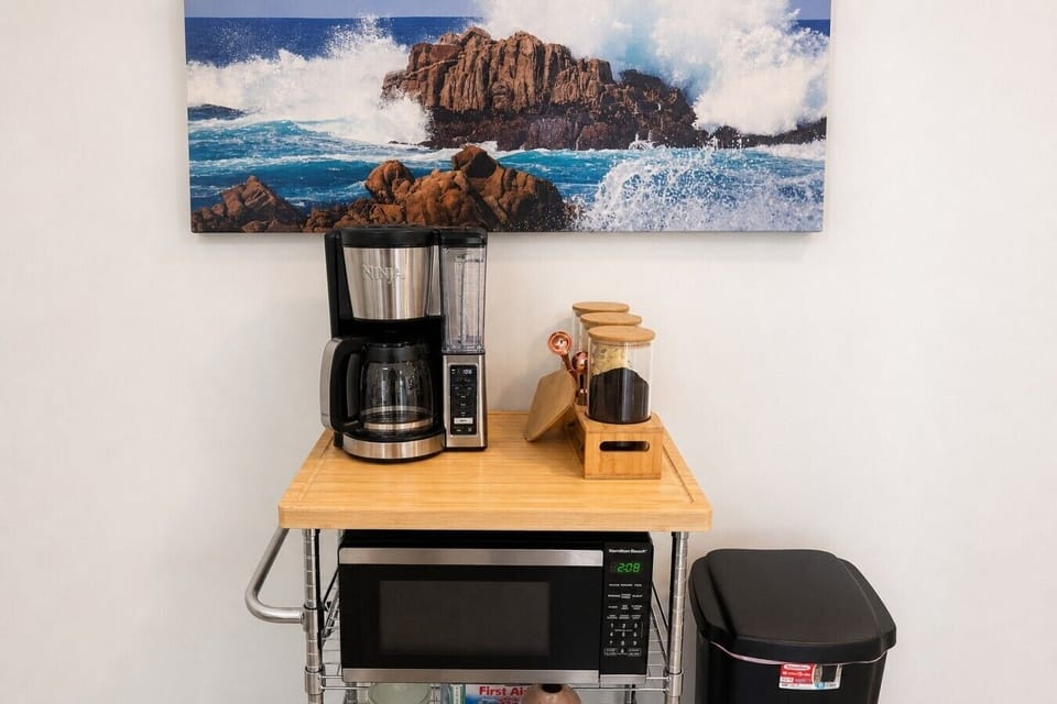 Coffee and tea station, grounds provided, with creamers and sugar
