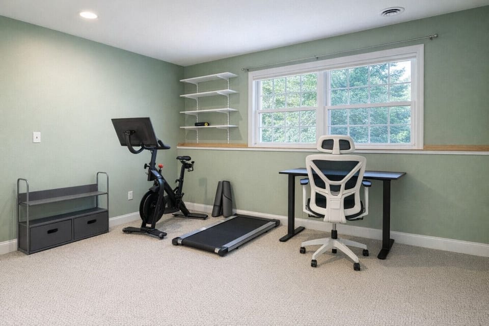 on the ground floor we have a peleton bike, walking pad, and yoga mats for those looking for movement and a secondary office space