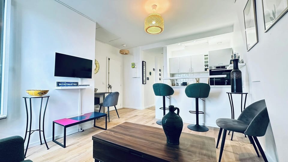 Bright living area overlooking Paris  The perfect place to enjoy your morning coffee with a view.