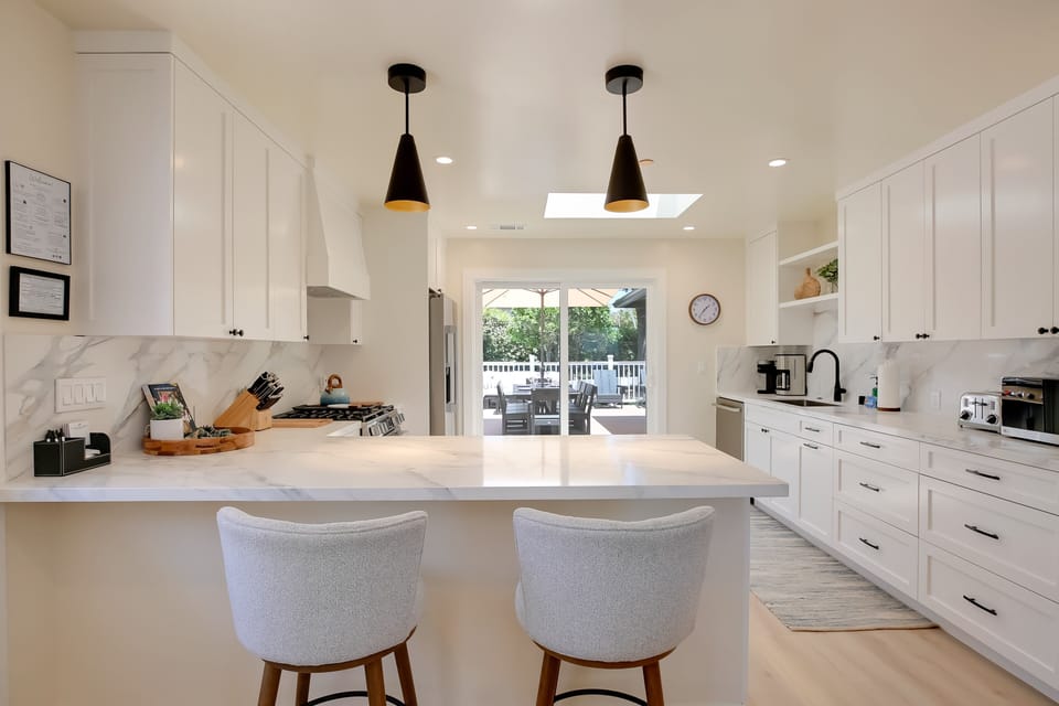 With beautiful views of the outdoor back patio and yard, this eat in kitchen is exceptional