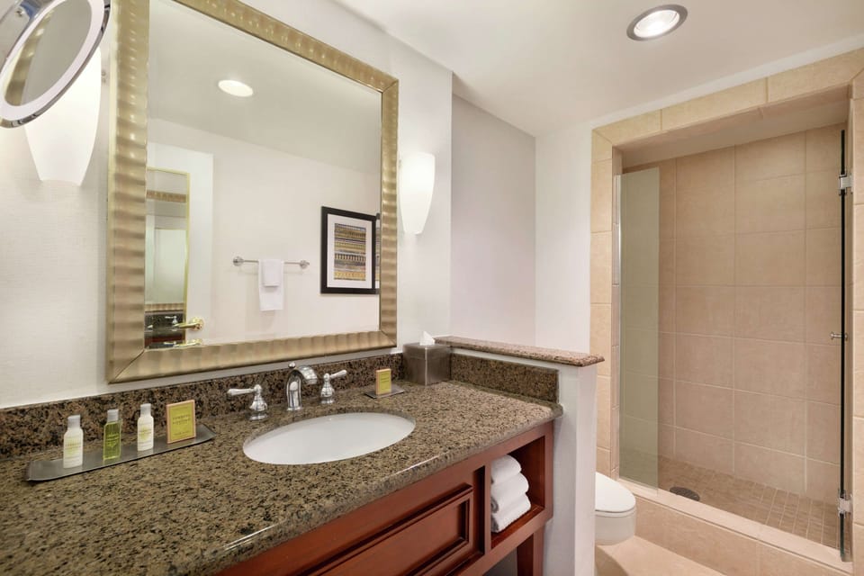 Combined shower/tub, designer toiletries, hair dryer, towels