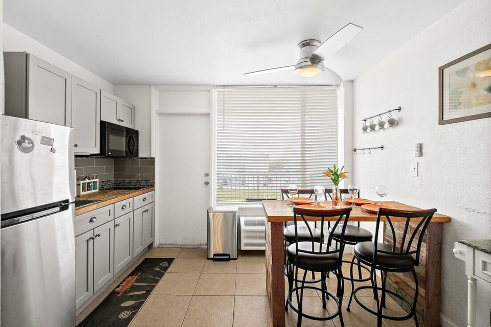 Kitchenette with dining seating, perfect for light meals during your beach stay.
