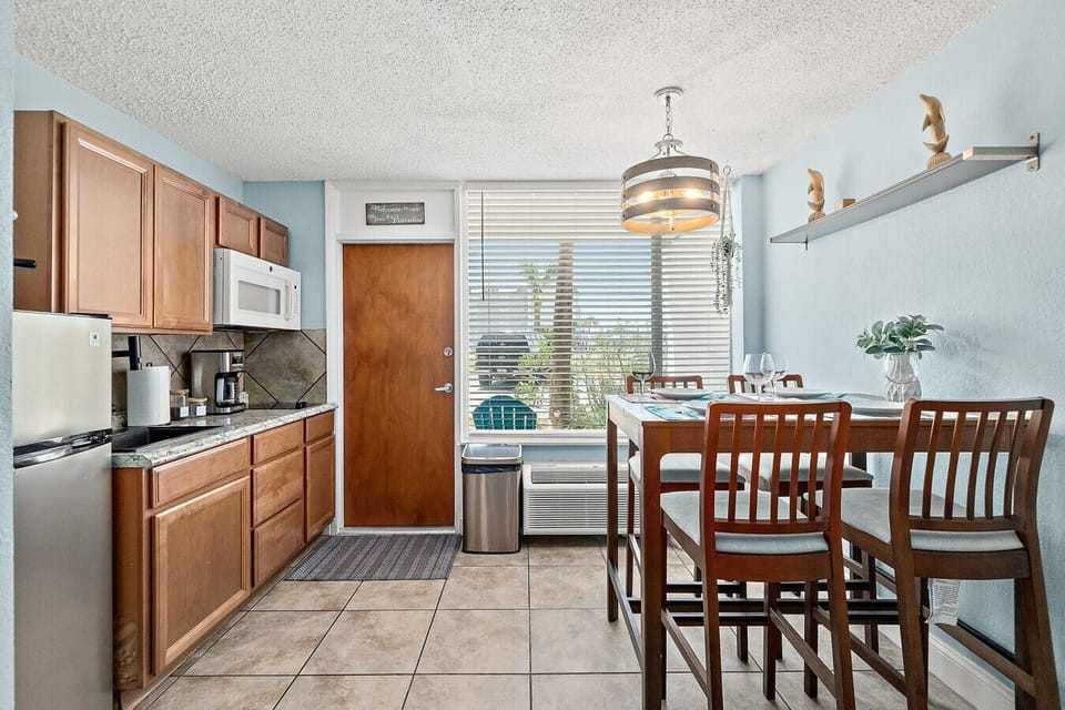 Compact kitchenette and dining space for light meals during your stay.