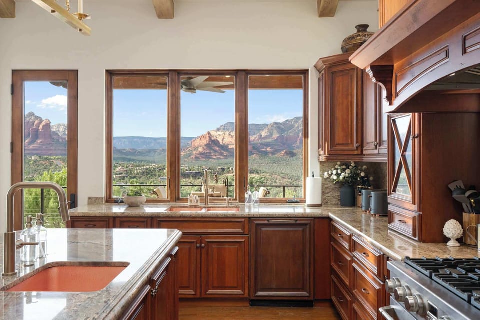Even everyday moments feel extraordinary when surrounded by panoramic red rock views from the heart of the home.