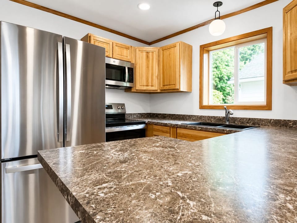 Full kitchen with warm wood cabinets and everything needed for easy meals.